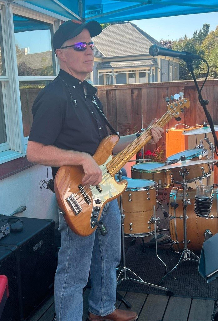 Chris Daniel playing his five-string electric bass on stage